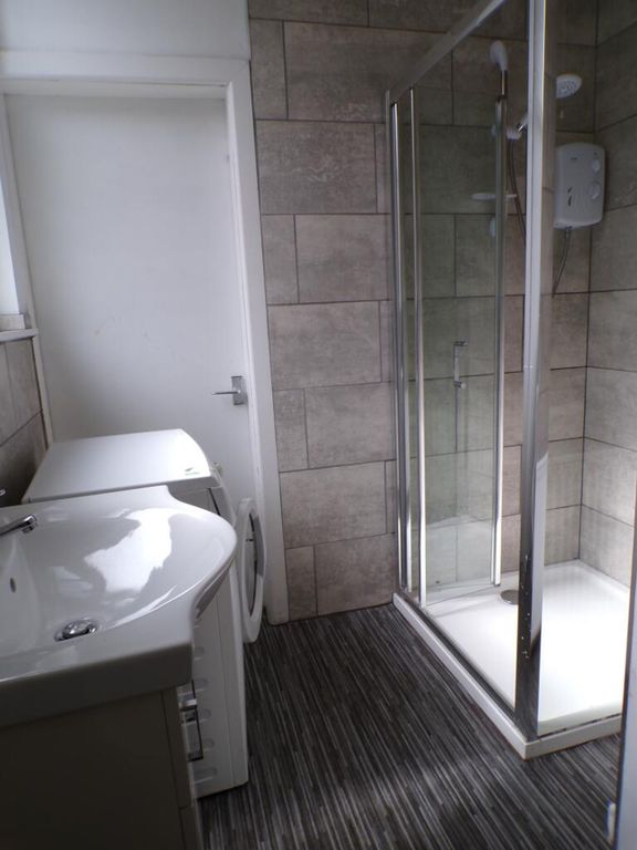 Property photo 2 of 9 This Modern Bathroom Features A Spacious Shower An...