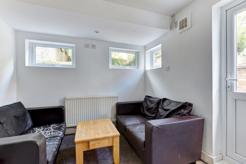 Property photo 3 of 18 A Bright And Welcoming Living Room With Large Wind...