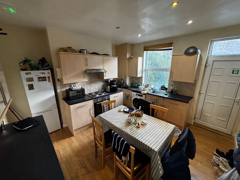 Property photo 2 of 8 Bright, Practical Kitchen With A Central Dining Ta...