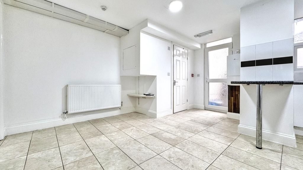 Property photo 3 of 10 Bright Kitchen With Modern Tiling And Natural Ligh...