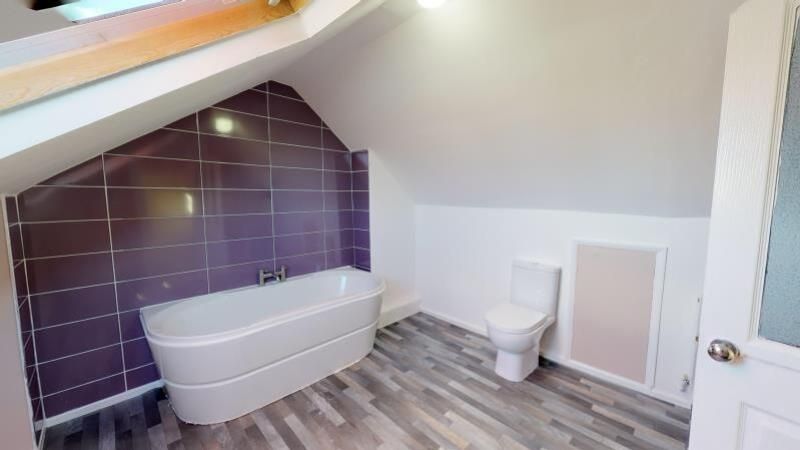 Property photo 2 of 6 A Modern Bathroom Suite Featuring A Sleek Bathtub,...