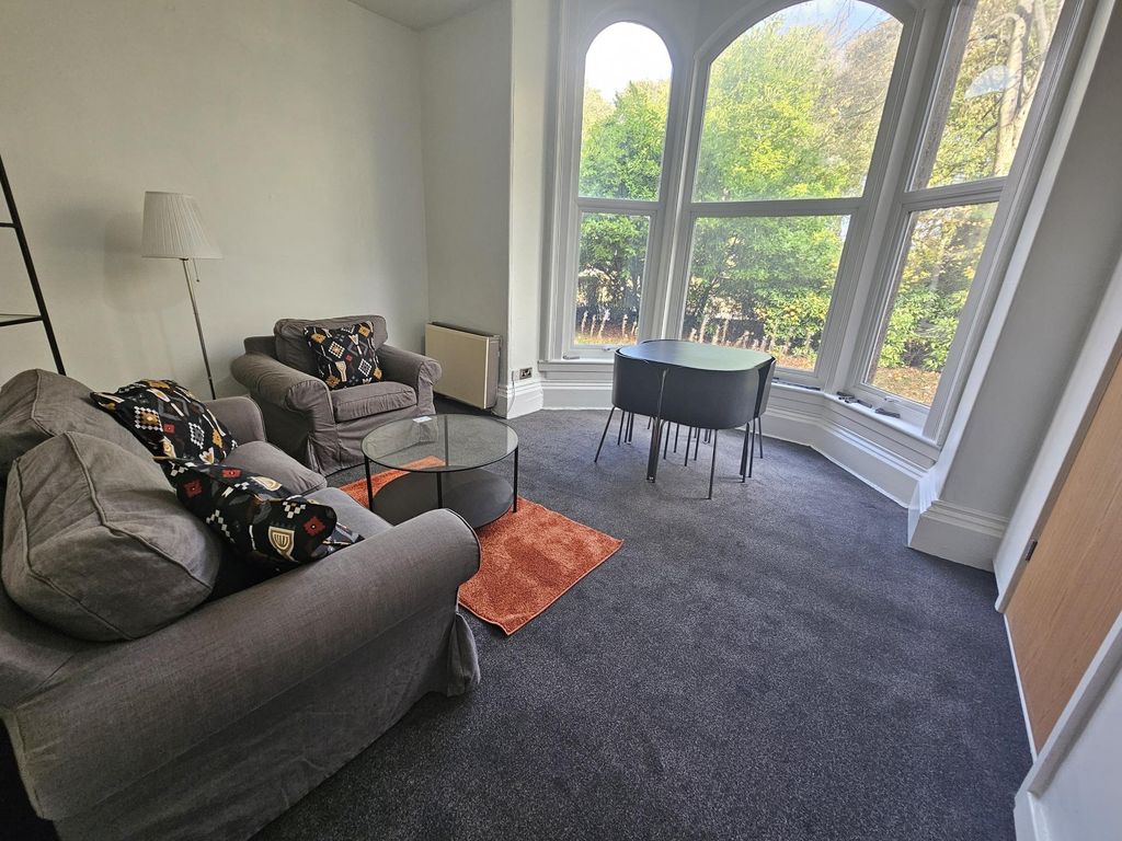 Property photo 1 of 10 A Bright And Spacious Living Room Featuring Large ...