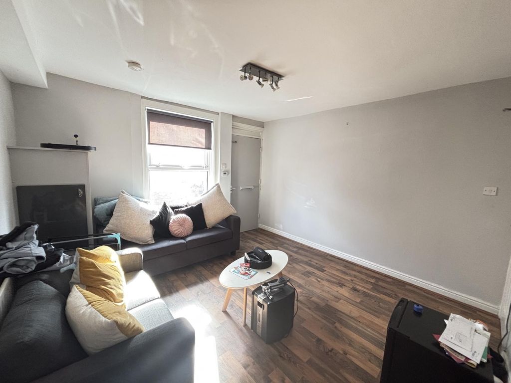 Property photo 3 of 20 A Bright And Welcoming Living Room Featuring A Com...