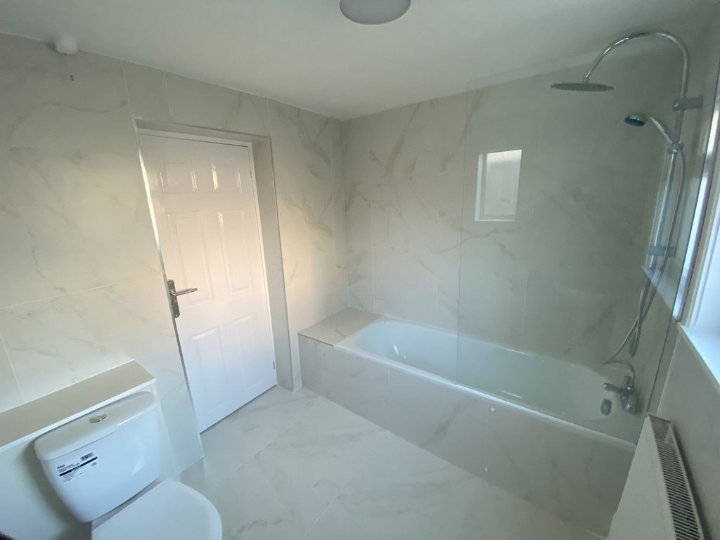 Property photo 2 of 11 A Clean And Modern Bathroom Featuring A Bath And S...