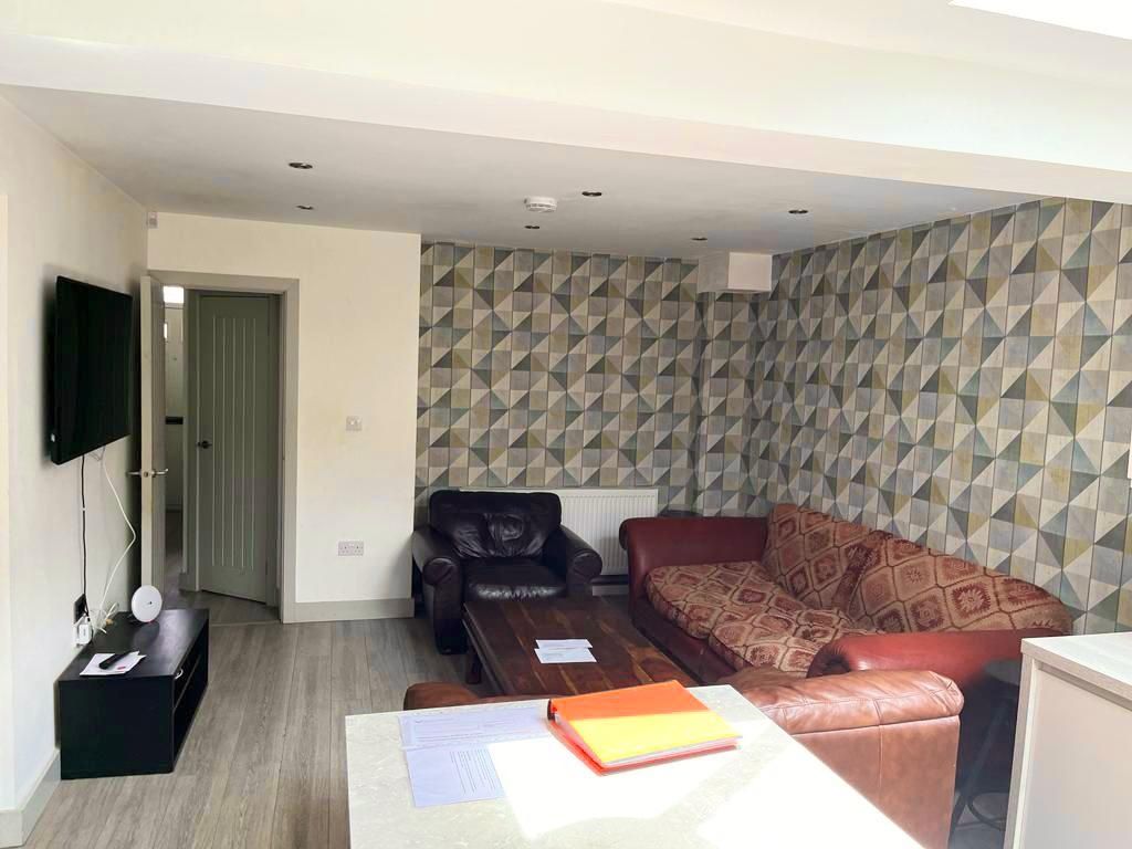 Property photo 3 of 13 Bright And Inviting Living Room Featuring Contempo...