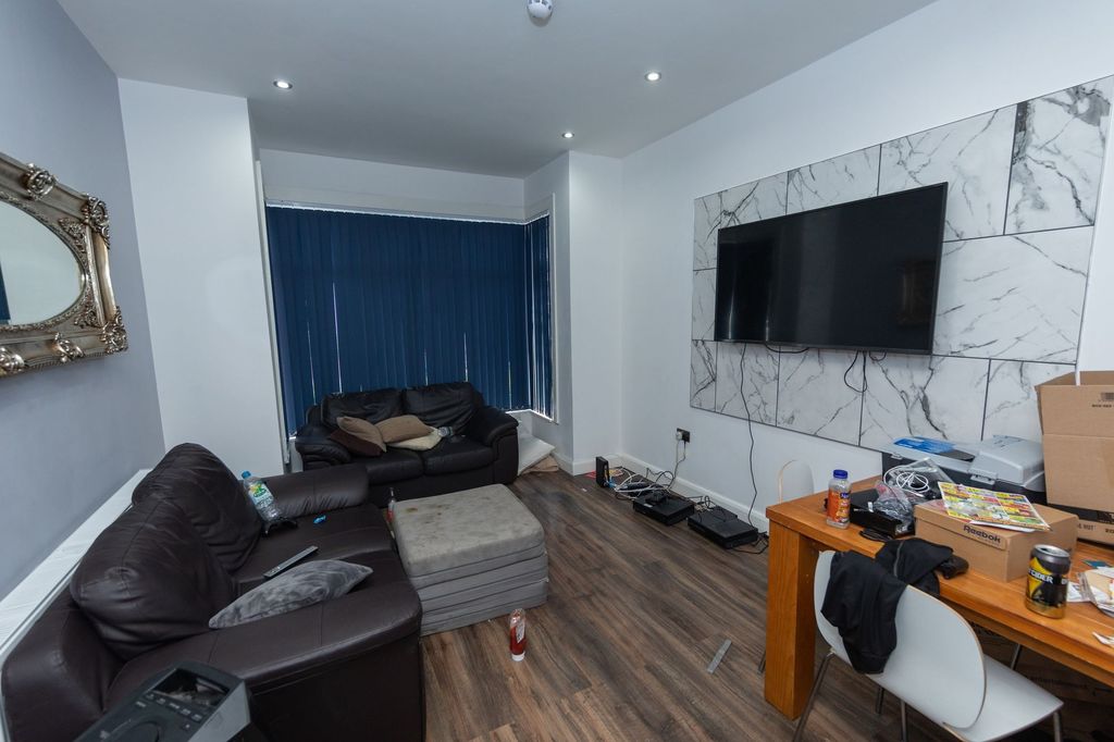 Property photo 3 of 6 A Contemporary Living Room With Two Black Leather ...