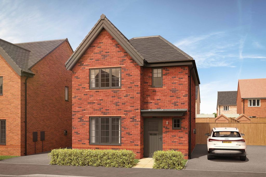 Property photo 1 of 8 A Modern Brick House With Manicured Hedges In The Foreground Sits On A Street With Other Houses And