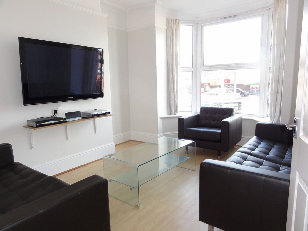 Property photo 2 of 18 Bright And Modern Living Room Featuring Three Blac...