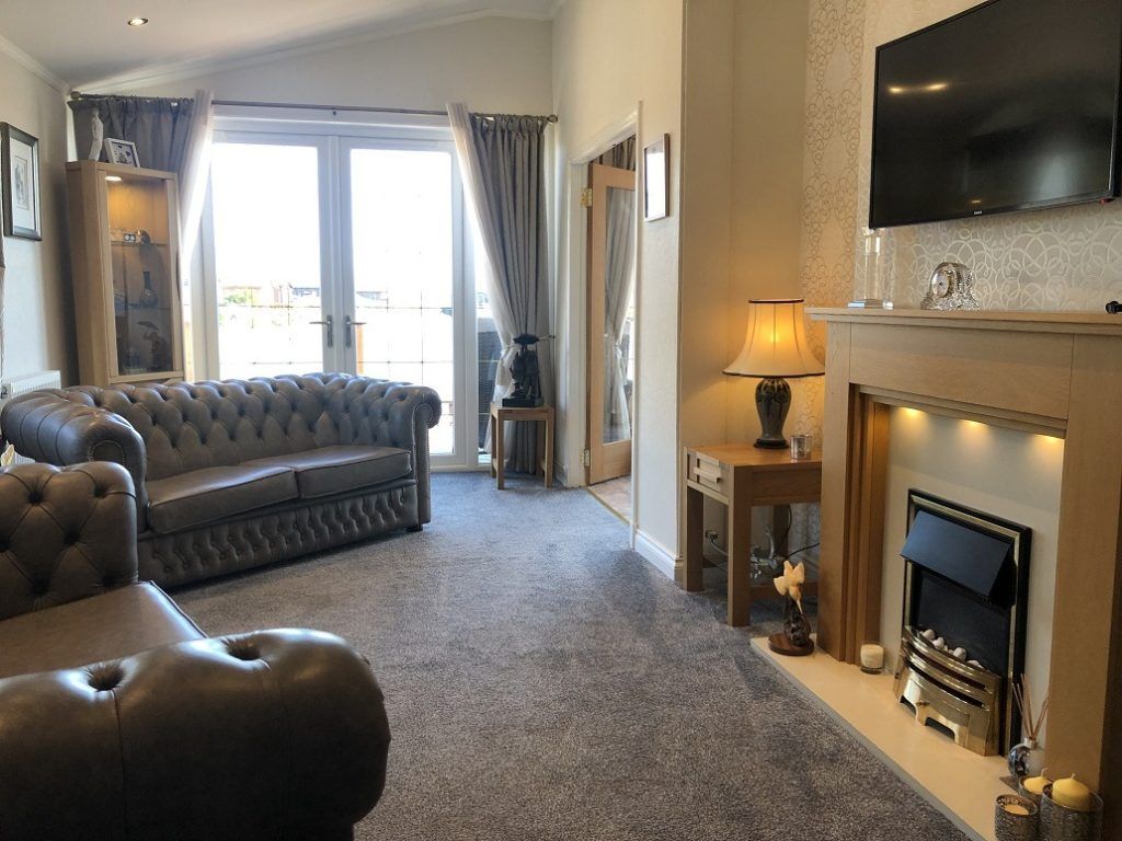 Property photo 2 of 18 Spacious Lounge With Leather Sofas And Fireplace