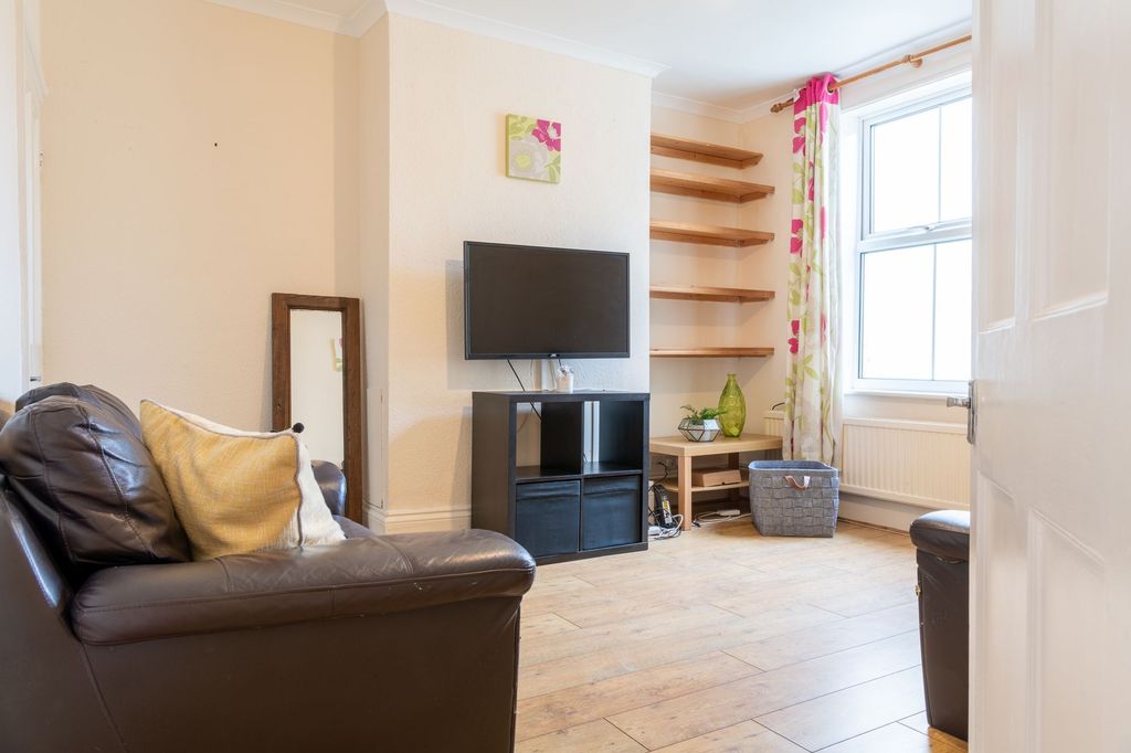 Property photo 3 of 9 Bright, Well-Kept Living Room With A Wall-Mounted ...