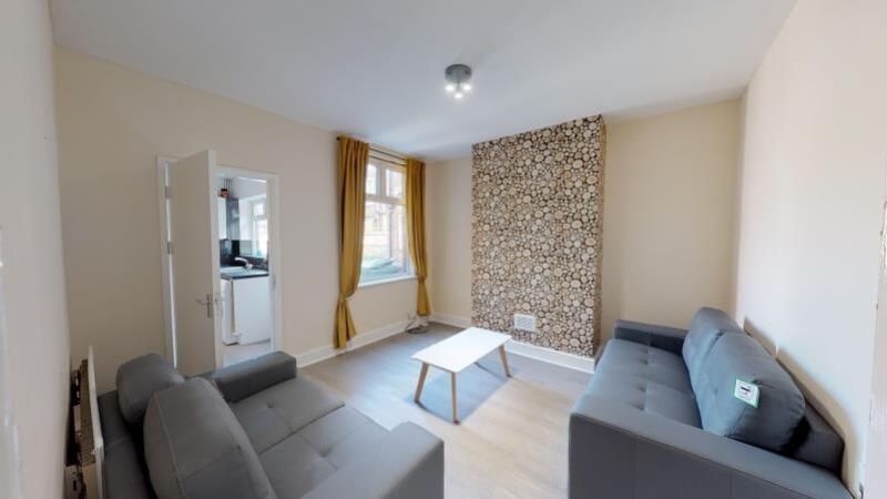 Property photo 3 of 6 A Bright And Inviting Living Room Featuring Modern...
