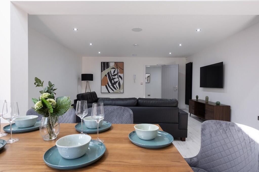 Property photo 1 of 8 Bright And Modern Living Room Featuring Contempora...