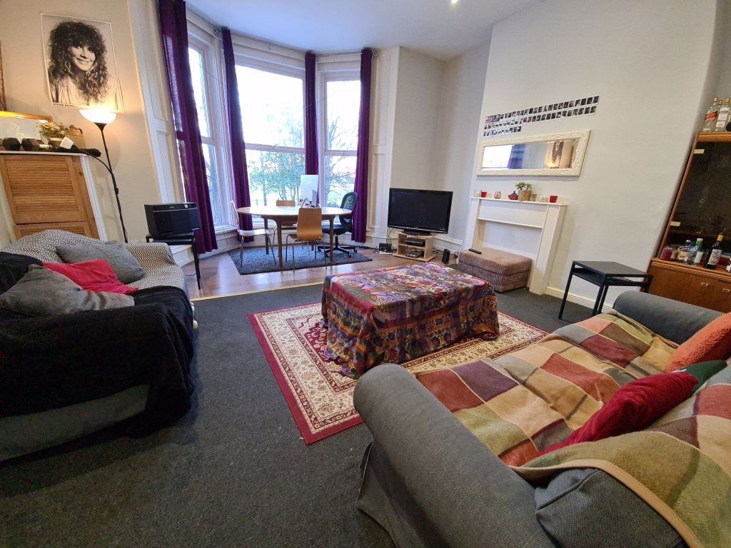 Property photo 2 of 9 A Spacious And Well-Lit Living Room Featuring Comf...