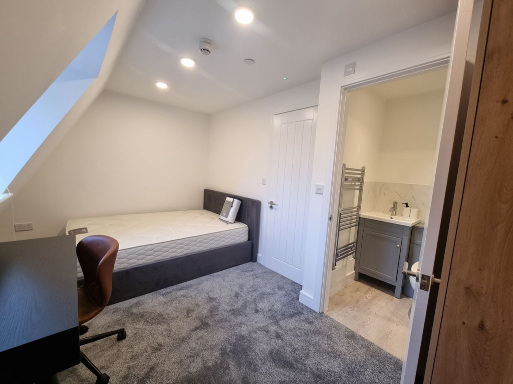 Property photo 2 of 7 A Compact Bedroom With An Angled Ceiling, Featurin...