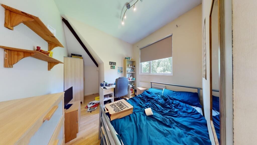Property photo 1 of 8 A Cozy Single Bedroom Featuring A Neatly Made Bed ...