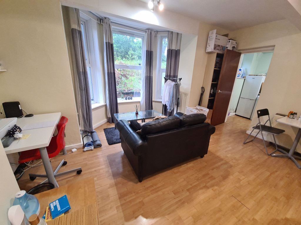 Property photo 2 of 5 Bright And Welcoming Living Room With Ample Natura...