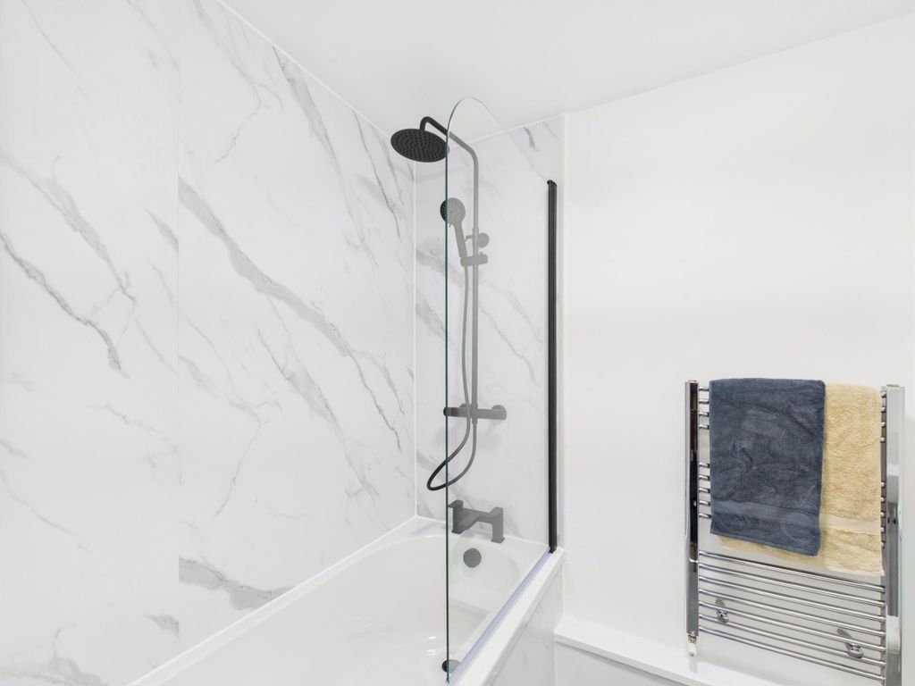 Property photo 3 of 4 Bright, Modern Bathroom Featuring A Sleek Shower-O...