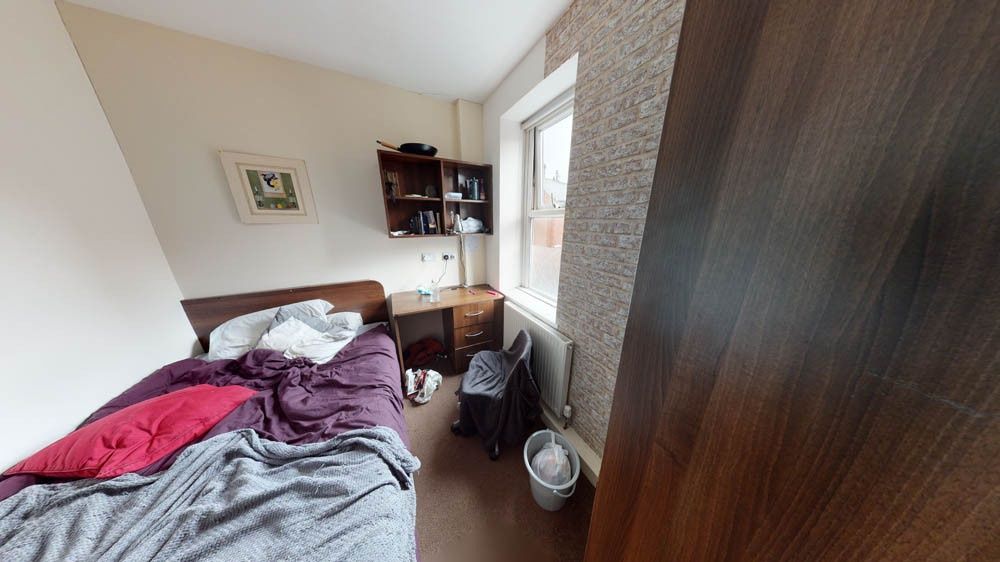 Property photo 3 of 8 A Cozy Bedroom With Natural Light Coming Through A...