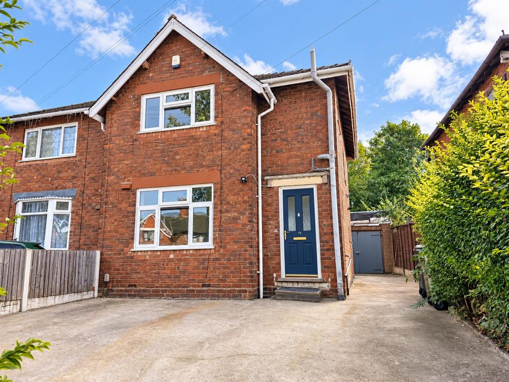 Property photo 1 of 9 Bright Brick House Exterior With Blue Door 73.Png