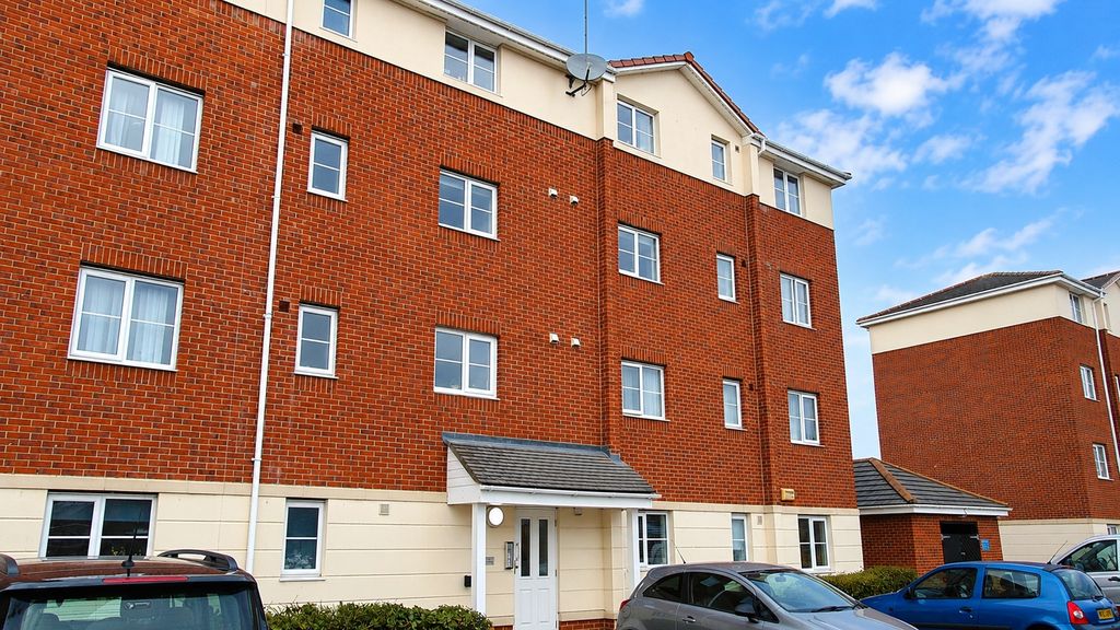 Property photo 1 of 8 Modern Brick Apartment Complex Under Blue Skies...