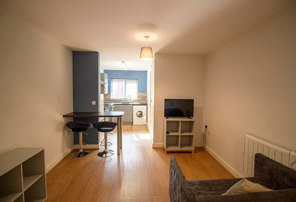 Property photo 1 of 5 Bright And Inviting Living Room With Modern Furnis...