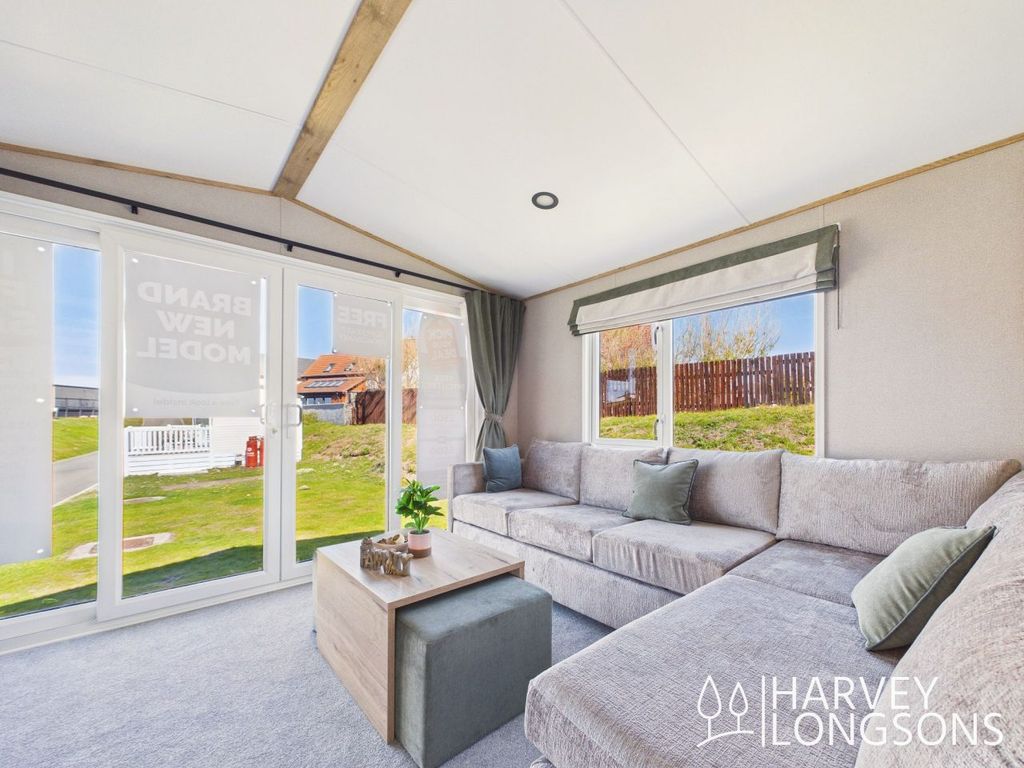 Property photo 2 of 13 Abi Ingleton Holiday Home Living Room With Corner Sofa And Patio Doors