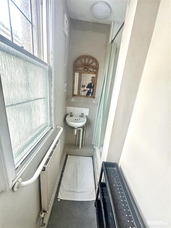 Property photo 3 of 10 Narrow Bathroom With Sink And Natural Light...