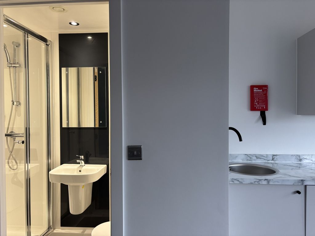 Property photo 3 of 3 A Modern And Clean Bathroom Featuring Stylish Fixt...