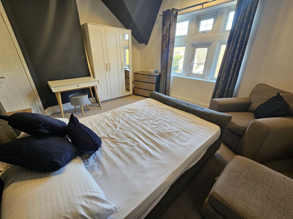 Property photo 3 of 21 A Spacious And Inviting Master Bedroom Featuring A...