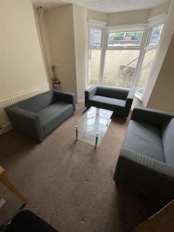 Property photo 1 of 10 Bright Lounge With Stylish Grey Sofas And Bay Wind...