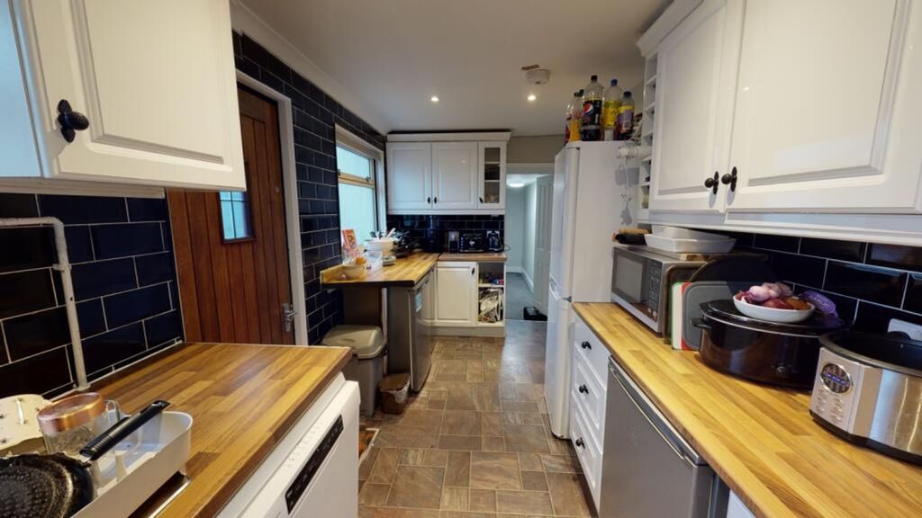 Property photo 3 of 8 Modern Kitchen Featuring Ample Countertop Space, S...