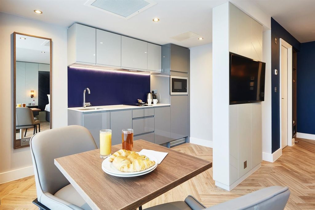 Property photo 2 of 5 Modern Open-Plan Kitchen With Sleek Grey Cabinets,...