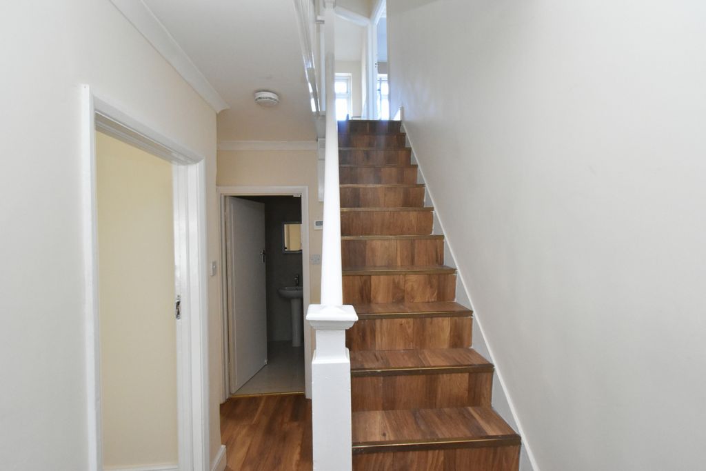 Property photo 3 of 17 Downstiars Hallway