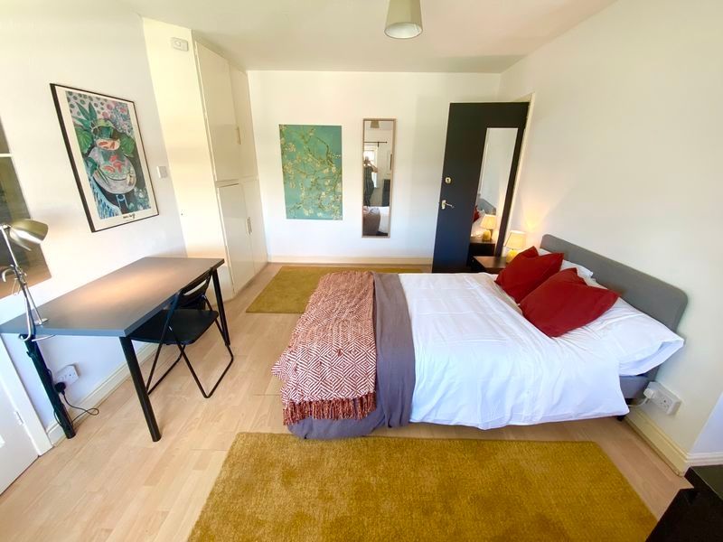 Property photo 1 of 8 Bright And Spacious Master Bedroom Featuring A Com...