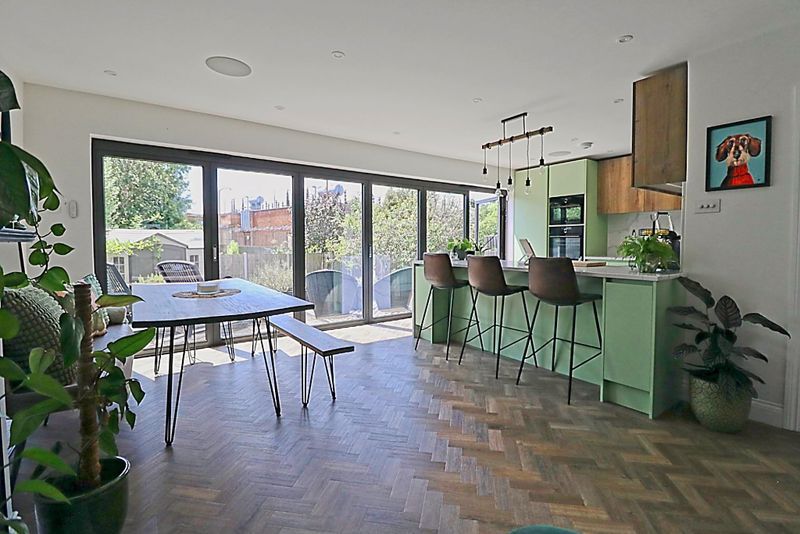Property photo 3 of 28 Family Room Dining Kitchen