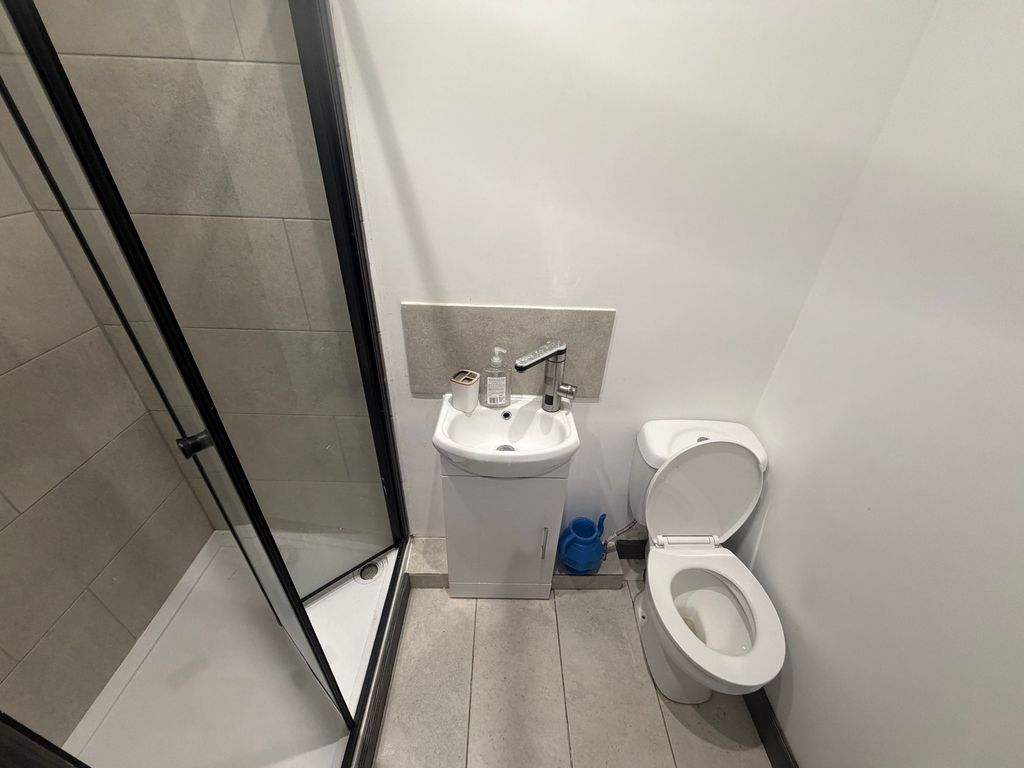 Property photo 3 of 6 Compact Modern Bathroom With Shower And Basin...