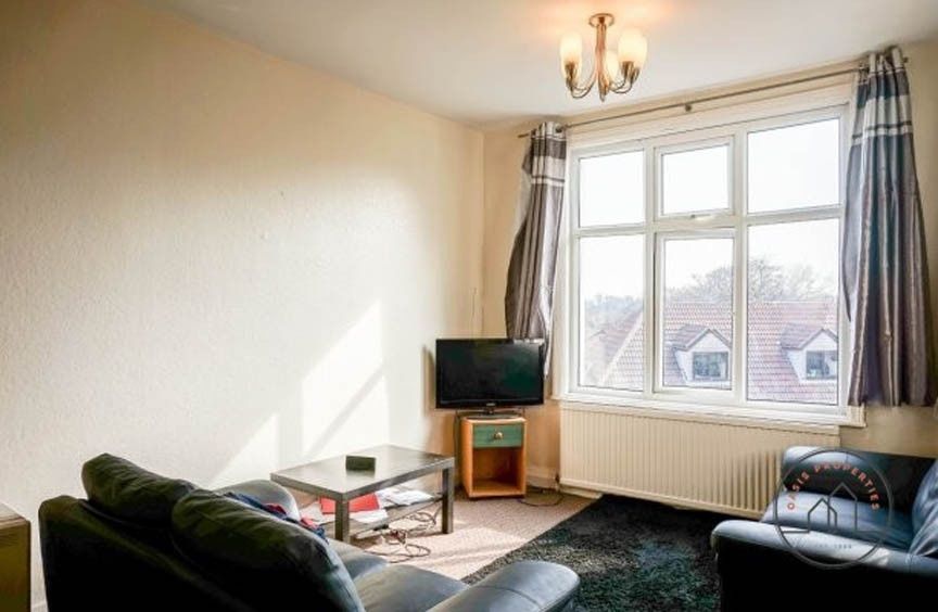 Property photo 2 of 5 A Bright And Welcoming Living Room With A Large Wi...