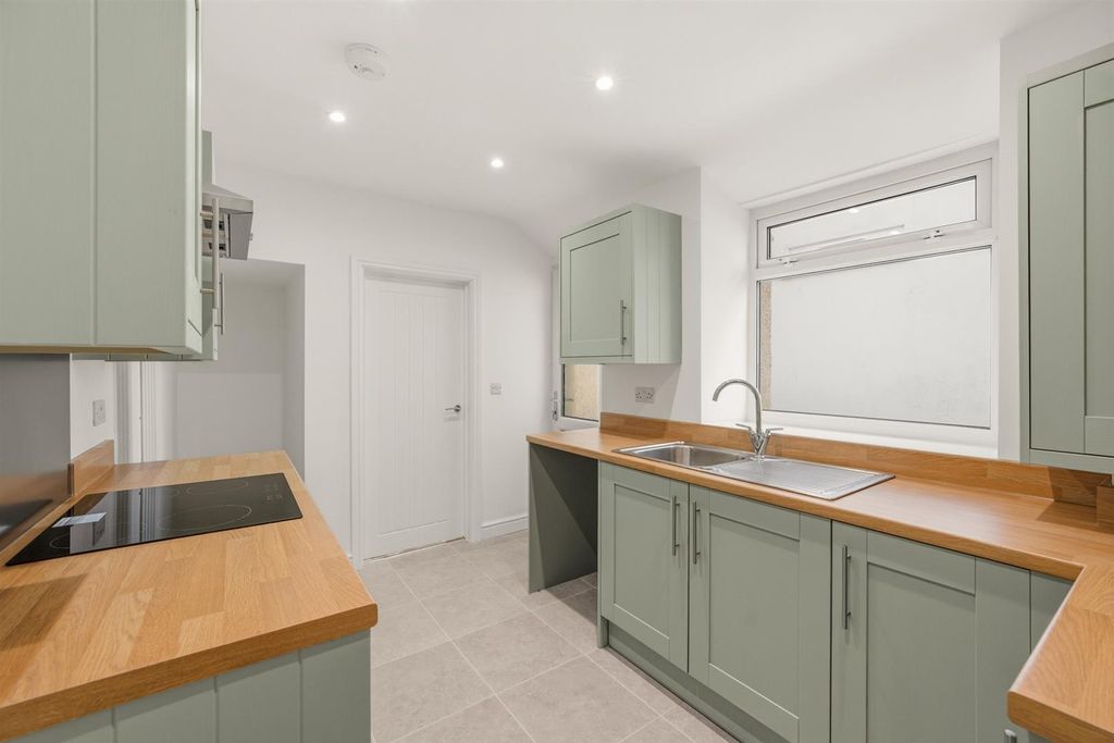 Property photo 2 of 28 Modern Kitchen With Sleek Sage Green Cabinetry...