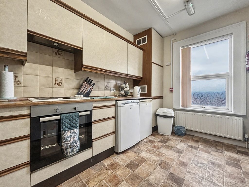 Property photo 3 of 7 Bright Kitchen With Ample Storage And Appliances...