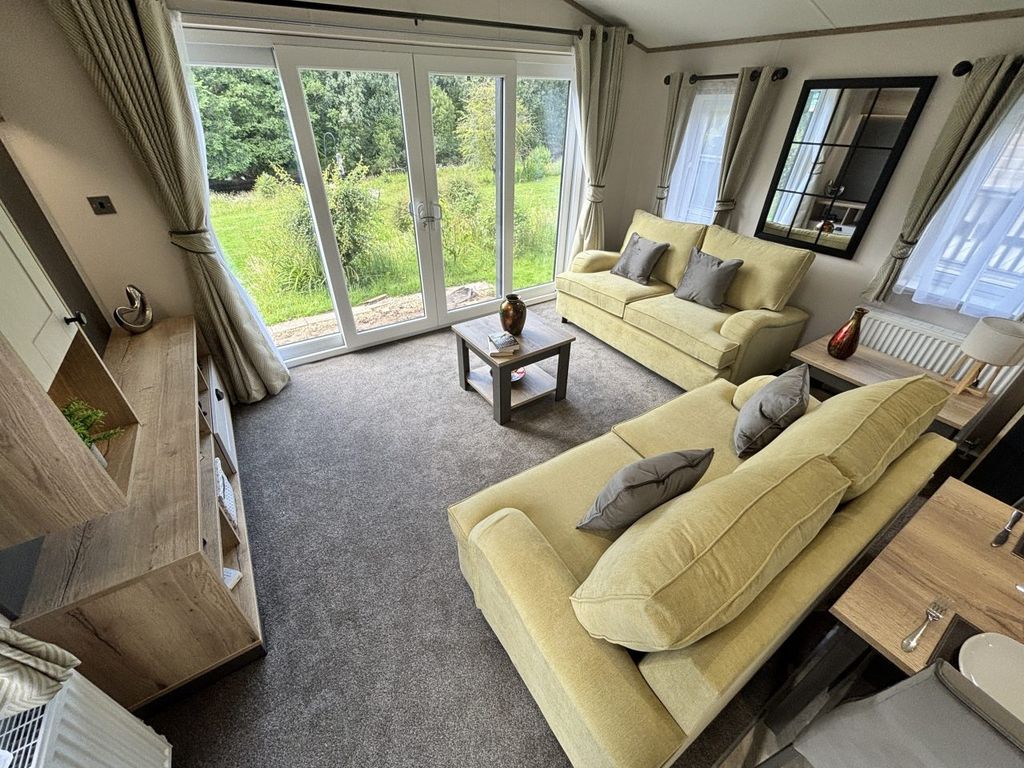 Property photo 2 of 10 Bright Willerby Gainsborough Lounge With Two Sofas And Patio Doors Overlooking The Garden