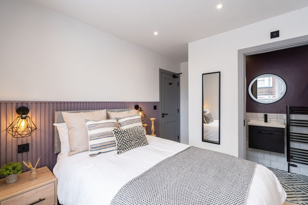 Property photo 3 of 33 A Beautifully Decorated Master Bedroom Featuring A...