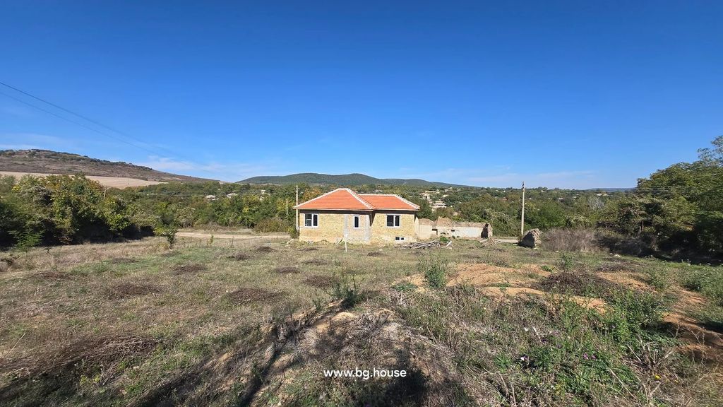 Property photo 3 of 28 Brick House With Red Tiled Roof Surrounded By Grass, Trees, And Hills In The Distance.