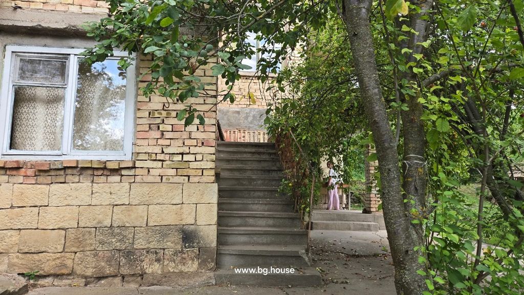 Property photo 3 of 53 Concrete Stairs Leading To Upper Floor Of Brick House, With Trees And A Person Standing Near The Stairs.