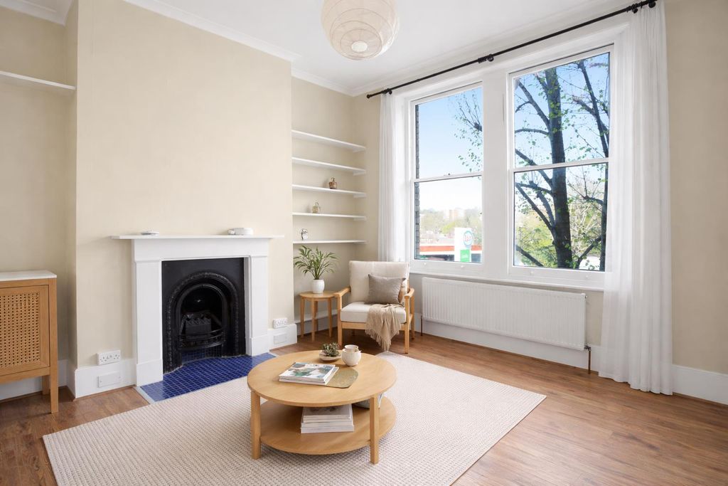 Property photo 2 of 14 Bright And Cozy Living Room.Png