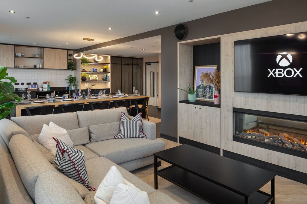 Property photo 3 of 12 A Modern And Stylish Living Room Featuring A Spaci...