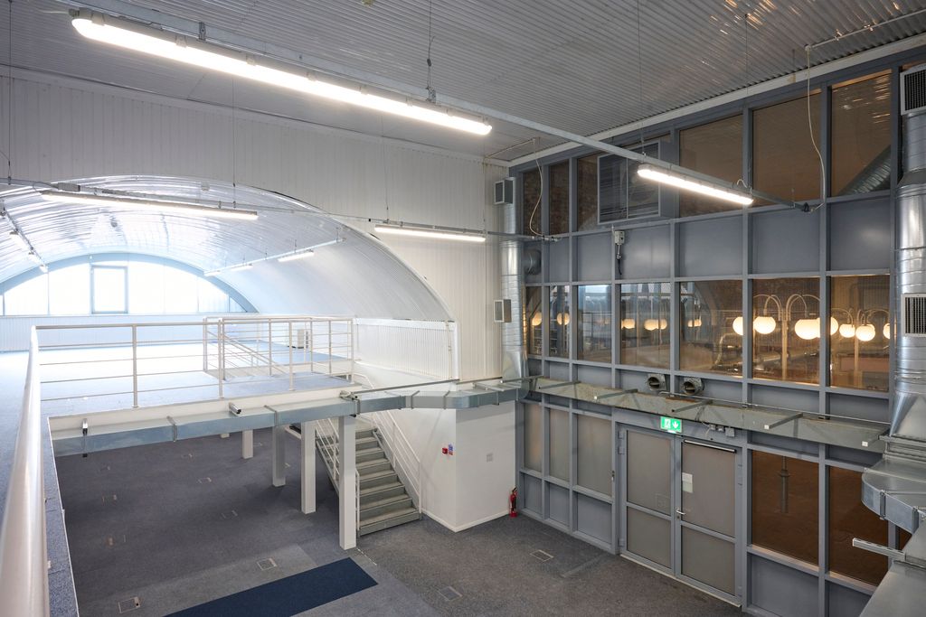 Property photo 3 of 9 An Arch With White Lining And A Ground Floor Level And A Mezzanine Level, Connected By Stairs.