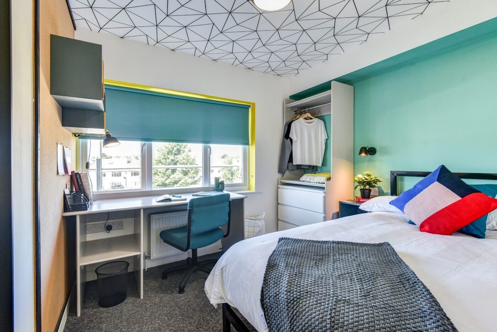 Property photo 1 of 5 Bright And Stylish Bedroom Featuring A Large Windo...