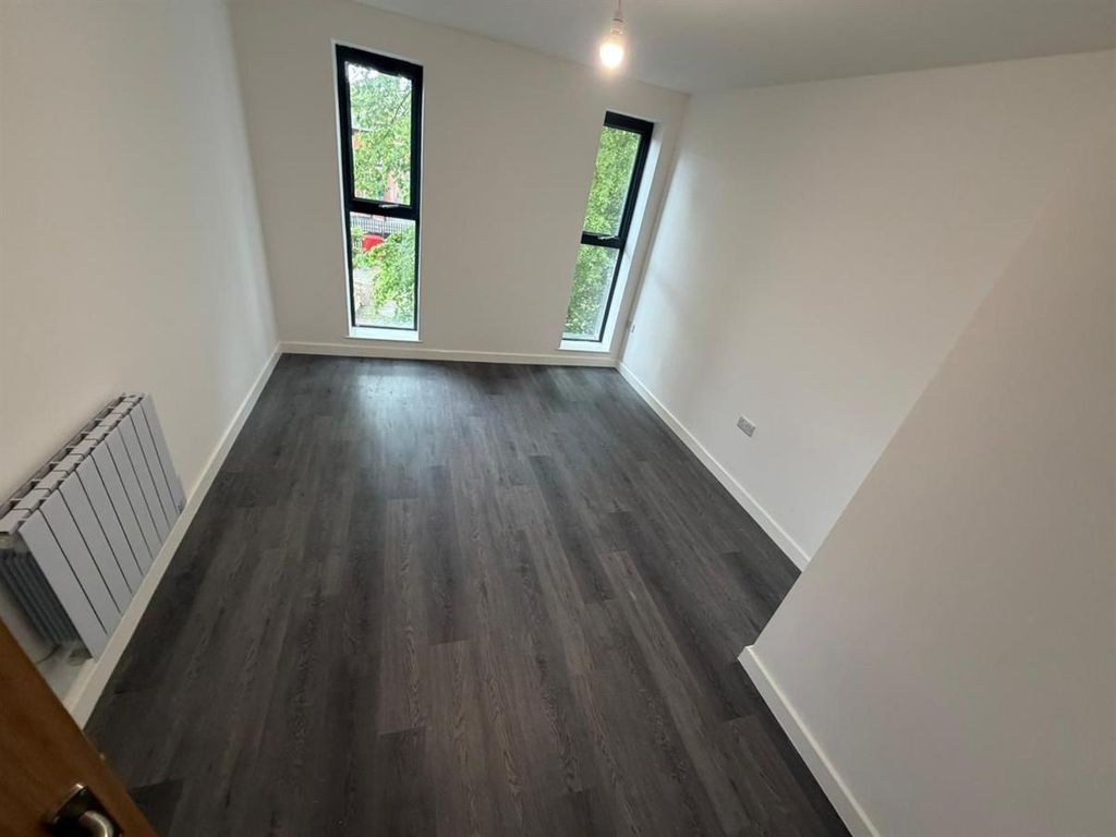 Property photo 3 of 4 Bright Modern Bedroom With Stylish Wood Flooring...