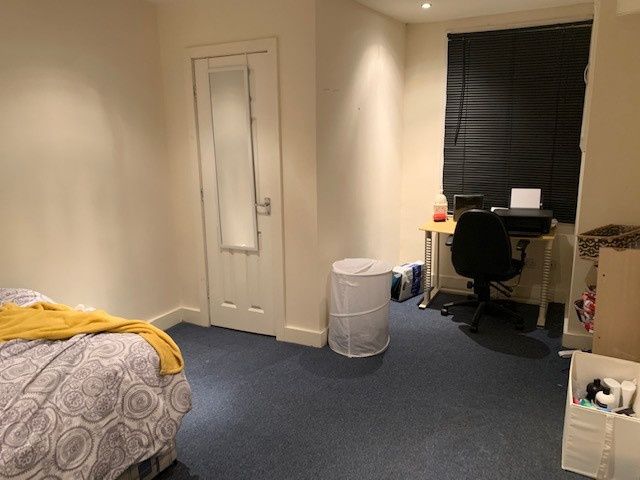 Property photo 1 of 26 A Tidy Bedroom Featuring A Bed, A Desk With A Chai...