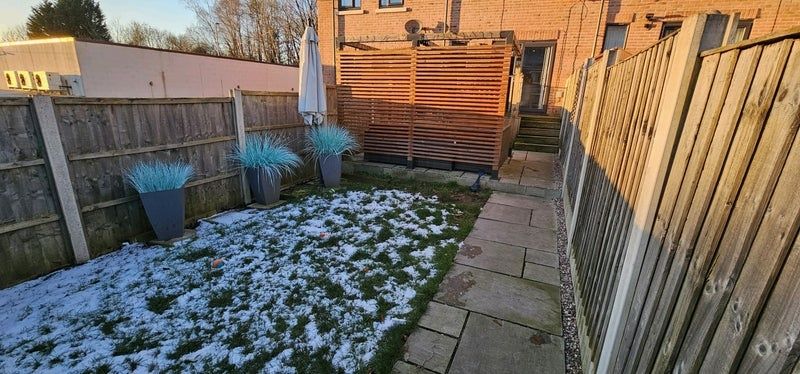 Property photo 3 of 8 A Charming Garden Featuring A Paved Walkway, Well-...